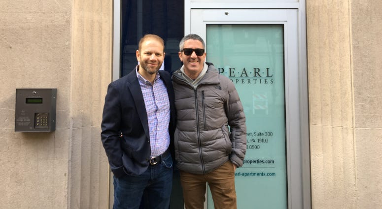 Steven Cook (left) and Michael Solomonov of the CookNSolo team stand in front of Pearl Properties' Harper, where their newest restaurant K'Far, an Israeli bakery, will open this summer. Steven Cook (left) and Michael Solomonov