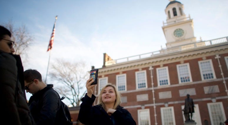 A tourist takes a selfie in front of the shuttered Independence Hall after the government shutdown on Jan. 20, 2018 in Philadelphia, Pennsylvania. Independence Hall