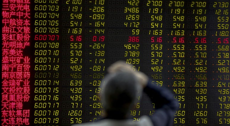 A man rubs his forehead as he monitors stock prices at a brokerage house in Beijing, Monday, May 13, 2019. Shares were mostly lower in Asia on Monday after trade talks between the U.S. and China ended Friday without an agreement. A man rubs his forehead as he monitors stock prices at a brokerage house in Beijing, Monday, May 13, 2019. Shares were mostly lower in Asia on Monday after trade talks between the U.S. and China ended Friday without an agreement.