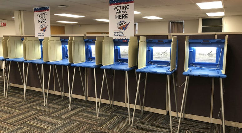 In this Sept. 20, 2018 photo, voting booths stand ready in downtown Minneapolis for the opening of early voting in Minnesota. In this Sept. 20, 2018 photo, voting booths stand ready in downtown Minneapolis for the opening of early voting in Minnesota.