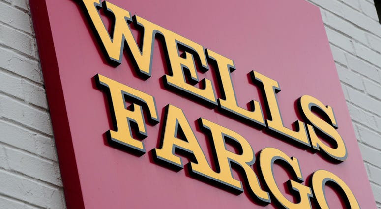 FILE - This Aug. 11, 2017, file photo shows a sign at a Wells Fargo bank location in Philadelphia. Wells Fargo bank location in Philadelphia.