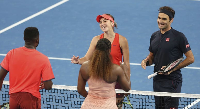 Roger Federer and Belinda Bencic of Switzerland, facing, wait at the net after winning their mixed doubles match against Frances Tiafoe and Serena Williams of the United States at the Hopman Cup in Perth, Australia, Tuesday, Jan. 1, 2019. Roger Federer and Belinda Bencic of Switzerland, facing, wait at the net after winning their mixed doubles match against Frances Tiafoe and Serena Williams of the United States at the Hopman Cup in Perth, Australia, Tuesday, Jan. 1, 2019.