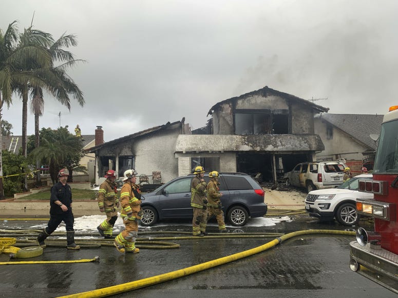 Firefighters respond to the scene of a plane crash at a home in Yorba Linda, Calif., Sunday, Feb. 3, 2019. Firefighters respond to the scene of a plane crash at a home in Yorba Linda, Calif., Sunday, Feb. 3, 2019.