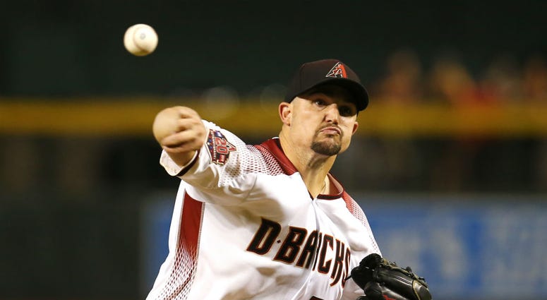 Arizona Diamondbacks pitcher Zack Godley throws in the first inning during a baseball game against the Philadelphia Phillies, Monday, Aug. 6, 2018, in Phoenix. Arizona Diamondbacks pitcher Zack Godley throws in the first inning during a baseball game against the Philadelphia Phillies, Monday, Aug. 6, 2018, in Phoenix.