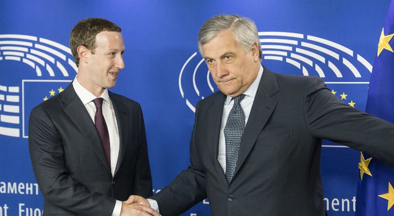 Founder and CEO of Facebook Mark Zuckerberg (L) shakes hands with European Parliament President Antonio Tajani ahead of a meeting at the European Parliament in Brussels, Belgium, May 22, 2018. Mark Zuckerberg shakes hands with European Parliament President Antonio Tajani