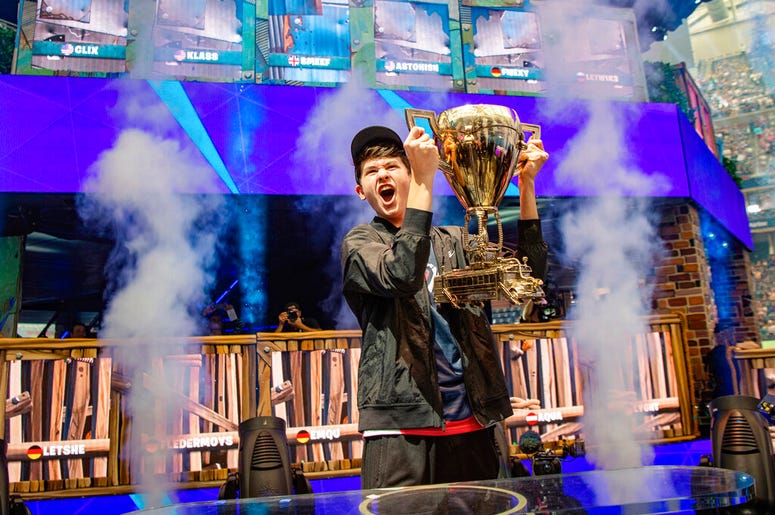 In this Sunday, July 28, 2019 photo provided by Epic games, Kyle Giersdorf reacts after he won the Fortnite World Cup solo finals in New York. Giersdorf, of Pottsgrove, Pa. who goes by the name "Bugha" when competing, racked up the most points and won $3