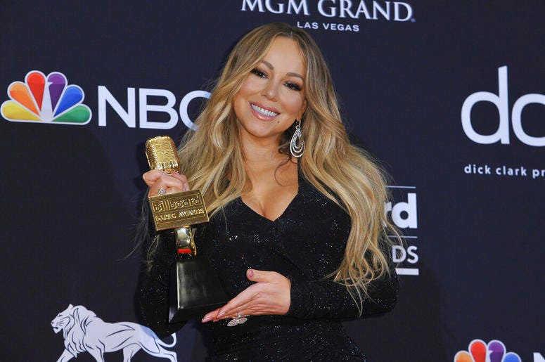 Mariah Carey poses in the press room with the Icon award at the Billboard Music Awards at the MGM Grand Garden Arena in Las Vegas