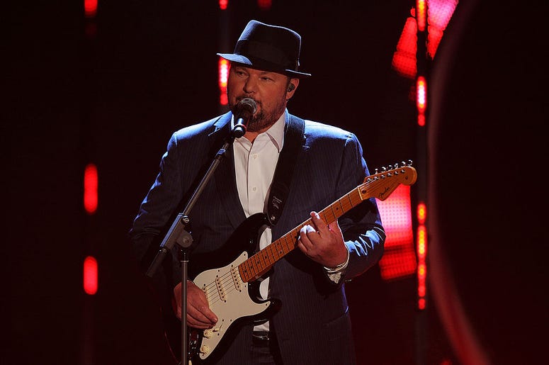 Christopher Cross on stage with a guitar