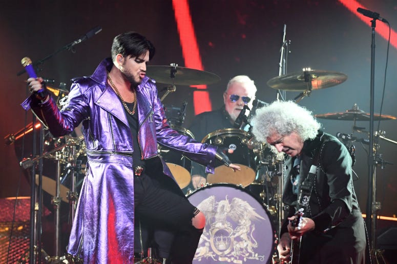 (L-R) Singer Adam Lambert, drummer Roger Taylor and guitarist Brian May of Queen (L-R) Singer Adam Lambert, drummer Roger Taylor and guitarist Brian May of Queen