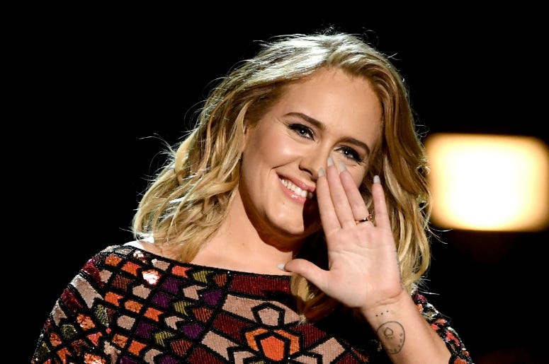 Adele performs onstage during The 59th GRAMMY Awards Adele performs onstage during The 59th GRAMMY Awards