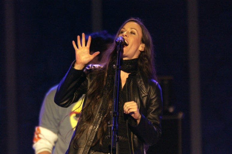 Alanis Morissette performs after the Medals Ceremony during the 2002 Salt Lake Winter Olympics Alanis Morissette performs after the Medals Ceremony during the 2002 Salt Lake Winter Olympics