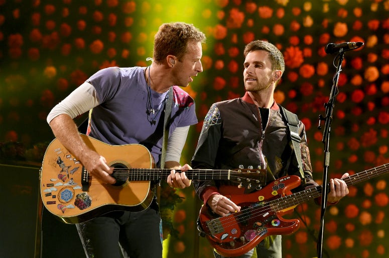 Chris Martin (L) and Guy Berryman of Coldplay perform at the Rose Bowl on October 6, 2017 Chris Martin (L) and Guy Berryman of Coldplay perform at the Rose Bowl on October 6, 2017