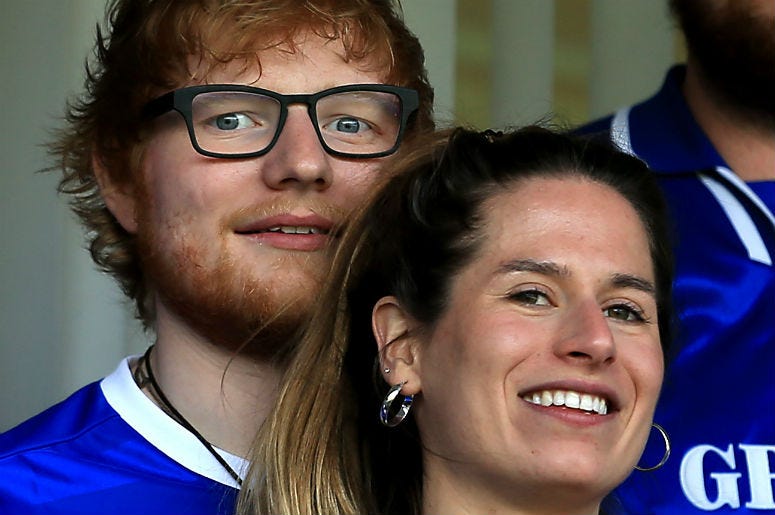 Ed Sheeran & Cherry Seaborn at Soccer Game Musician Ed Sheeran and fiance Cherry Seaborn look on during soccer game in Ipswich, England.
