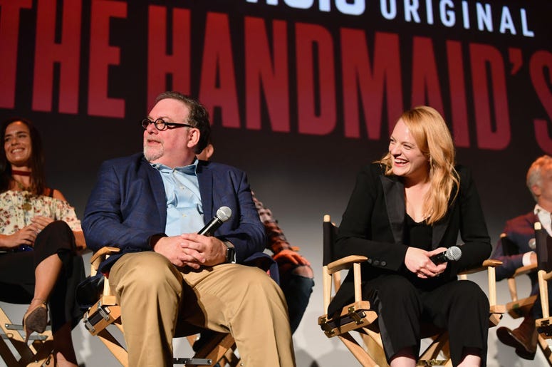 Bruce Miller and Elisabeth Moss speak onstage during "The Handmaid's Tale" Hulu finale at The Wilshire Ebell Theatre on July 9, 2018 in Los Angeles, California Bruce Miller and Elisabeth Moss speak onstage during "The Handmaid's Tale" Hulu finale at The Wilshire Ebell Theatre on July 9, 2018 in Los Angeles, California
