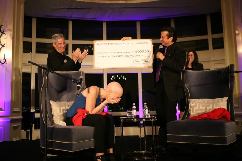 Steve Perry and Radio.com on-air personality Erin O'Malley during fundraising event Steve Perry and Radio.com on-air personality Erin O'Malley during fundraising event
