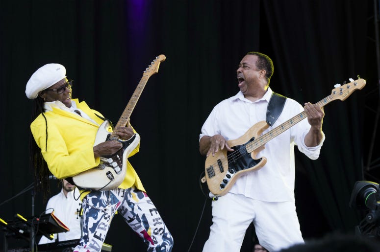 Chic Nile Rodgers (left) and Chic perform on stage during the Isle of Wight festival at Seaclose Park, Newport.