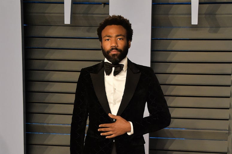 BEVERLY HILLS, CA - MARCH 4: Donald Glover arrives at the 2018 Vanity Fair Oscar Party at the Wallis Annenberg Center for the Performing Arts on March 4, 2018 in Beverly Hills, California. BEVERLY HILLS, CA - MARCH 4: Donald Glover arrives at the 2018 Vanity Fair Oscar Party at the Wallis Annenberg Center for the Performing Arts on March 4, 2018 in Beverly Hills, California.