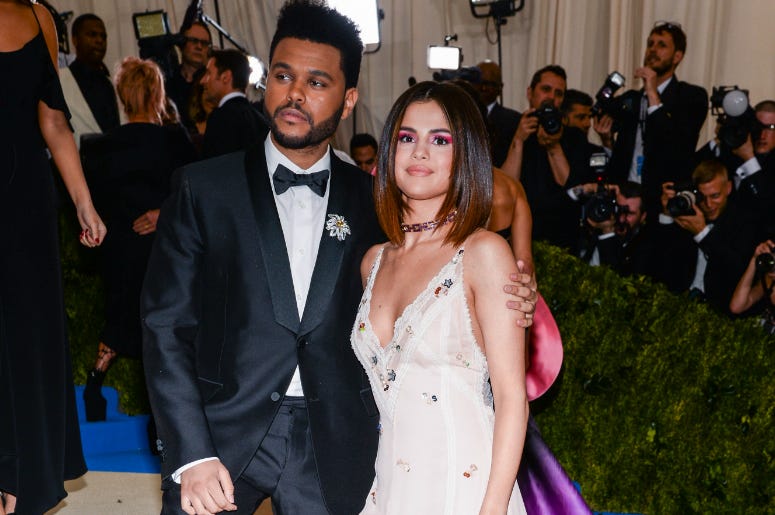 The Weeknd and Selena Gomez arriving at The Metropolitan Museum of Art Costume Institute Benefit in New York City. The Weeknd and Selena Gomez arriving at The Metropolitan Museum of Art Costume Institute Benefit in New York City.