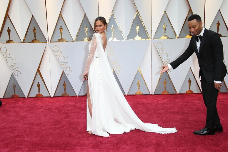 Chrissy Teigen (L) and John Legend on the red carpet during the 89th Academy Awards Chrissy Teigen (L) and John Legend on the red carpet during the 89th Academy Awards