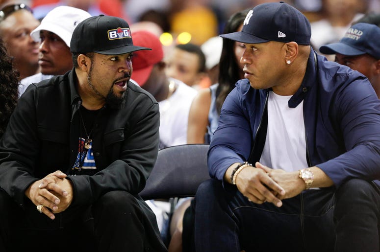 Ice Cube and LL Cool J Jul 2, 2017; Charlotte, NC, USA; Movie actor Ice Cube and actor LL Cool J talk during the game between 3's Company and Ghost Ballers at Spectrum Center. Mandatory Credit: Jeremy Brevard-USA TODAY Sports