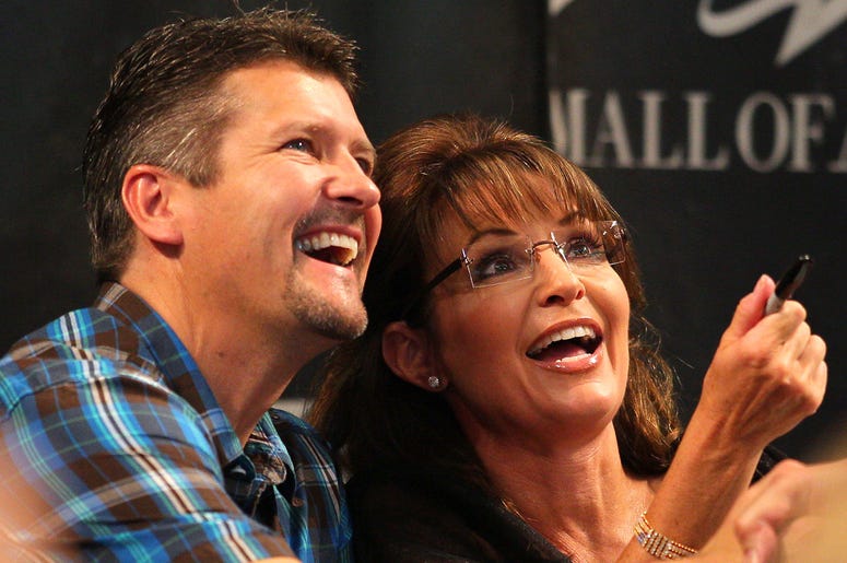 Todd Palin and Sarah Palin BLOOMINGTON, MN - JUNE 29: Todd Palin and Sarah Palin greet fans at the Best Buy Rotunda at Mall of America on June 29, 2011 in Bloomington, Minnesota. (Photo by Adam Bettcher/Getty Images)