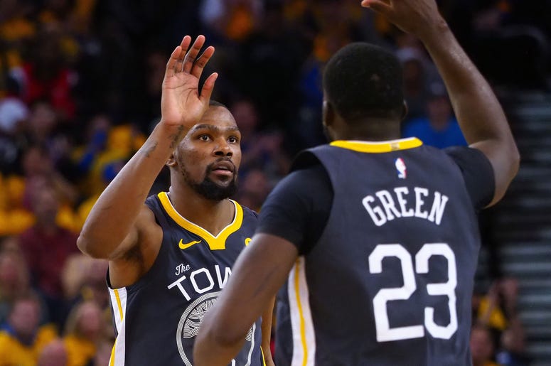 Kevin Durant and Draymond Green Apr 16, 2018; Oakland, CA, USA; Golden State Warriors forward Kevin Durant (35) high fives forward Draymond Green (23) after a basket against the San Antonio Spurs during the fourth quarter in game two of the first round of the 2018 NBA Playoffs at Oracle