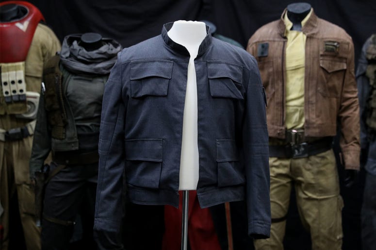 Han Solo's jacket, as worn by Harrison Ford in 'Star Wars: The Empire Strikes Back' 7/30/2018 - Han Solo's jacket, as worn by Harrison Ford in Star Wars: The Empire Strikes Back (estimate £500,000 - £1,000,0000) on display in front of costumes from Rogue One: A Star Wars story, on display at the Prop Store head office near Ri