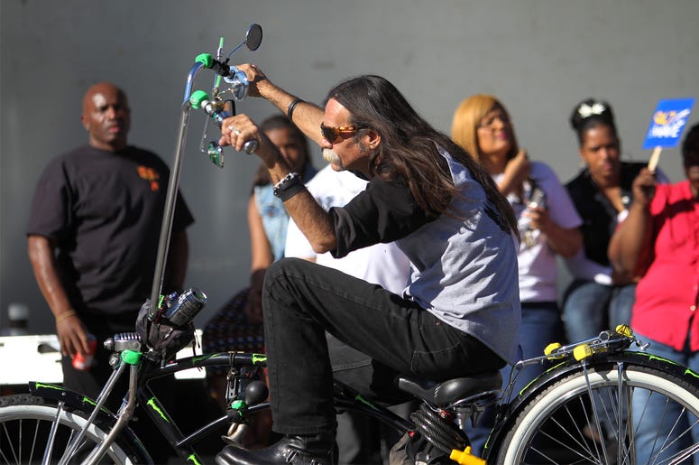 Lowrider Bicycle Annual MLK Day Parade Marches Through Los Angeles LOS ANGELES, CA - JANUARY 20: A man rides a custom lowrider bicycle in the 29th annual Kingdom Day Parade on January 20, 2014 in Los Angeles, California. The Kingdom Day Parade honors the memory of African