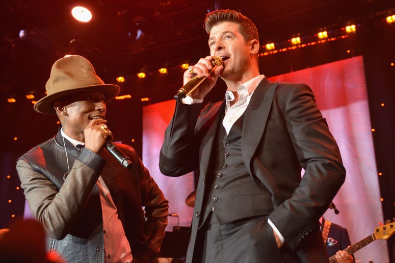 Pharrell Williams and Robin Thicke BEVERLY HILLS, CA - JANUARY 25: Recording artists Pharrell Williams and Robin Thicke perform onstage during the 56th annual GRAMMY Awards Pre-GRAMMY Gala and Salute to Industry Icons honoring Lucian Grainge at The Beverly Hilton on January 25, 2014 in Bev