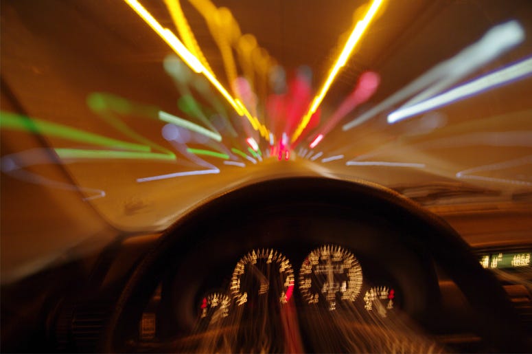 Blurred motion car drivers view traveling through tunnel - car motion blur night traffic fast dui driving under the influence Blurred motion car drivers view traveling through tunnel - car motion blur night traffic fast dui driving under the influence