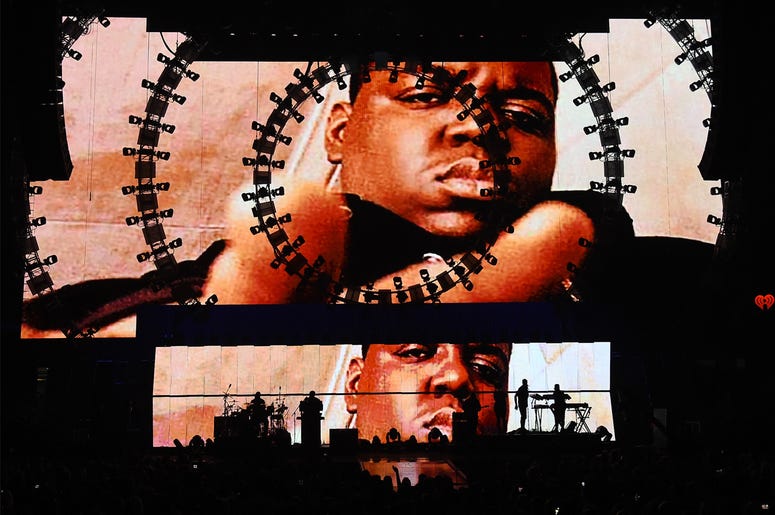 Notorious B.I.G. LAS VEGAS, NV - SEPTEMBER 19: Images of the late rapper The Notorious B.I.G. are shown during a performance by recording artist Sean 'Puff Daddy' Combs at the 2015 iHeartRadio Music Festival at MGM Grand Garden Arena on September 19, 2015 in Las Vegas, Ne