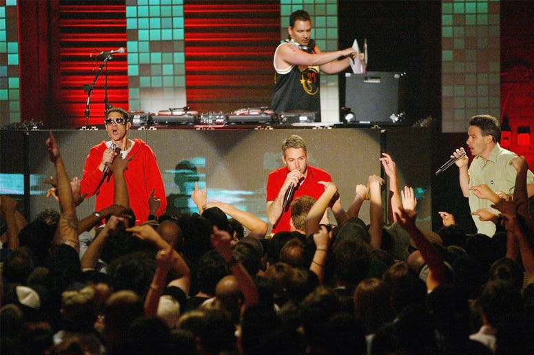 Michael Diamond 'Mike D', Adam Yauch 'MCA', Adam Horovitz 'Ad-Rock' and DJ Mix Master Mike of the Beastie Boys LAS VEGAS, NV - JUNE 9: (L-R) Michael Diamond 'Mike D', Adam Yauch 'MCA', Adam Horovitz 'Ad-Rock' and DJ Mix Master Mike(behind) of the Beastie Boys perform during MTV2's 2$Bill concert series at the Huntridge Theater, June 9, 2004 in Las Vegas, Nevada. (