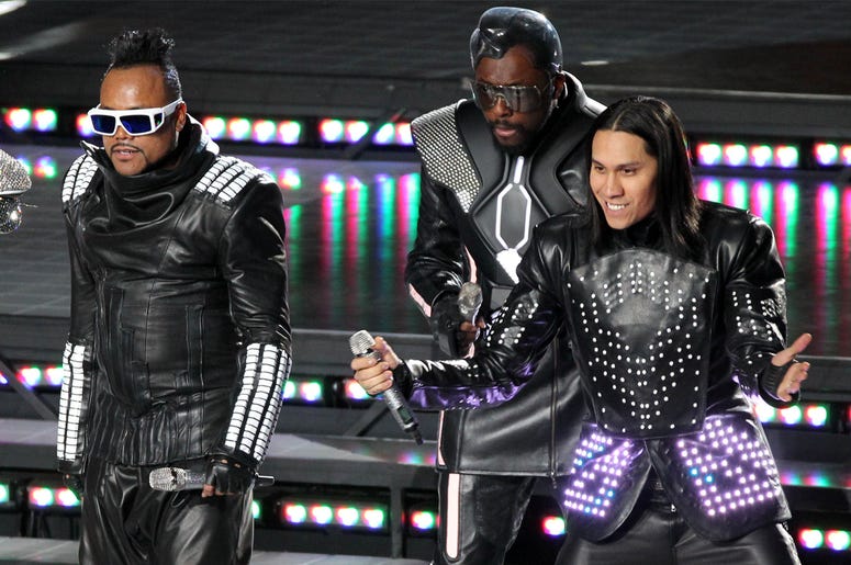 Black Eyed Peas Feb 6, 2011; Arlington, TX, USA; Black Eyed Peas recording artists Fergie (not pictured), Apl.De.Ap (second left), Will.I.Am (second right) and Taboo (right) perform during halftime of Super Bowl XLV between the Green Bay Packers and Pittsburgh Steelers a
