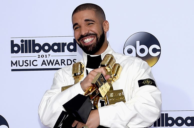 Drake at Billboard Music Awards LAS VEGAS, NV - MAY 21: Rapper Drake poses in the press room with his awards for Top Artist, Top Male Artist, Top Billboard 200 Artist, Top Billboard 200 Album for 'Views,' Top Hot 100 Artist, Top Song Sales Artist, Top Streaming Artist, Top Streaming Son