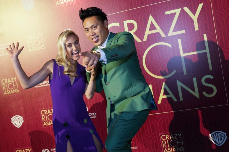 6ab2217fbb774e41acfad93c7ff02011 Director John Chu and his wife Kristin Hodge pose for photographers as they arrive for the red carpet screening of the movie "Crazy Rich Asians" on Tuesday, Aug. 21, 2018, in Singapore. (AP Photo/Don Wong)