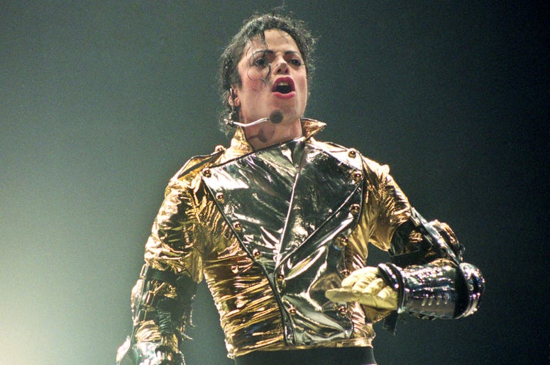 Michael Jackson AUCKLAND, NEW ZEALAND - NOVEMBER 10: Michael Jackson performs on stage during is 'HIStory' world tour concert at Ericsson Stadium November 10, 1996 in Auckland, New Zealand. (Photo by Phil Walter/Getty Images)
