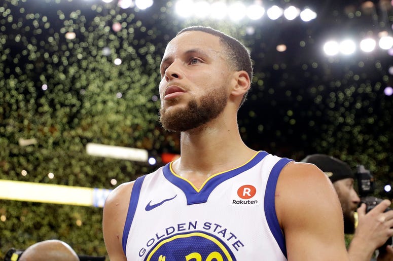 AP18129188784874 Confetti falls as Golden State Warriors' Stephen Curry walks off the court at the end of Game 5 of the team's NBA basketball second-round playoff series against the New Orleans Pelicans on Tuesday, May 8, 2018, in Oakland, Calif. Golden State won 113-104