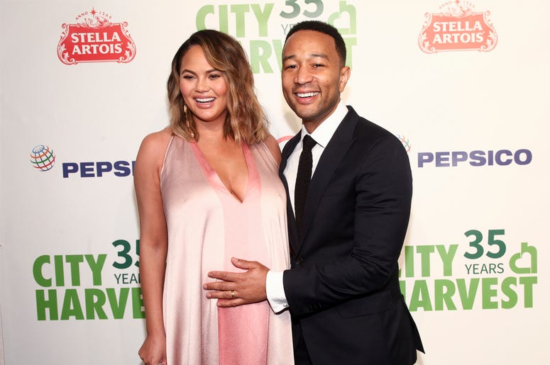 AP18140786658090 In this Tuesday, April 24, 2018, file photo, Chrissy Teigen, left, and John Legend attend City Harvest's 35th Anniversary Gala at Cipriani 42nd Street on in New York. Teigen and Legend now have a baby boy to go with their toddler girl. The couple introduc