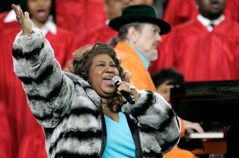 AP18225598755913 In this Feb. 5, 2006 file photo, Aretha Franklin and Dr. John, background on piano, perform the national anthem before the Super Bowl XL football game in Detroit. Franklin died Thursday, Aug. 16, 2018 at her home in Detroit. She was 76. (AP Photo/Gene J.