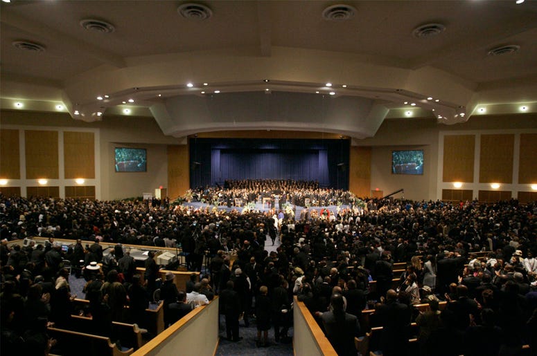 AP18239564068986 In this Nov. 2, 2005 file photo, people attend the funeral for Rosa Parks at the Greater Grace Temple in Detroit. Aretha Franklin's funeral will be held at Greater Grace Temple in Detroit Friday, Aug. 31, 208. Franklin died Aug. 16, 2018 of pancreatic can