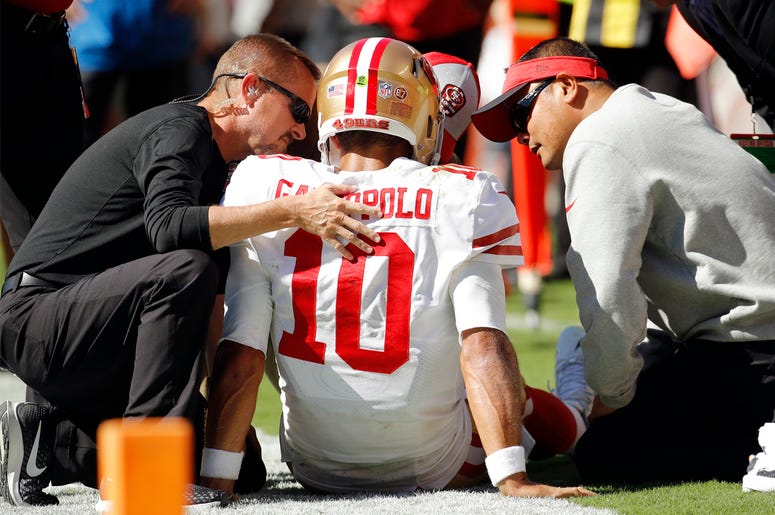 AP18266740045064 Trainers attend to San Francisco 49ers quarterback Jimmy Garoppolo (10) who was injured after a tackle by Kansas City Chiefs defensive back Steven Nelson during the second half of an NFL football game in Kansas City, Mo., Sunday, Sept. 23, 2018. (AP Photo