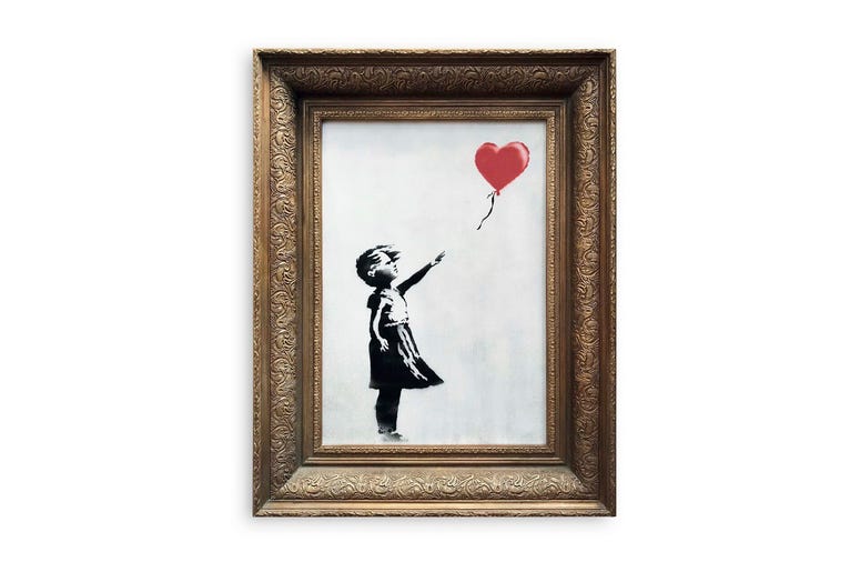 'Girl with Balloon' by artist Banksy In this undated photo provided by Sotheby's the spray-painted canvas 'Girl with Balloon' by artist Banksy is pictured. Art prankster Banksy has struck again. A work by the elusive street artist self-destructed in front of startled auction-goers on Friday,