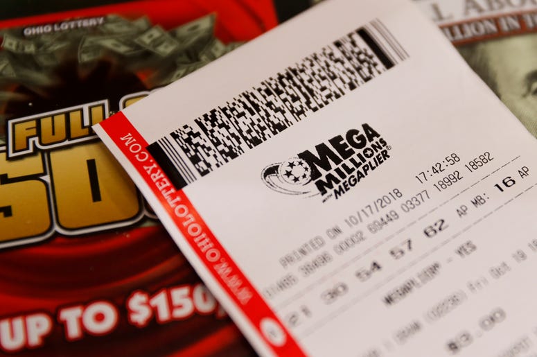 AP18290796556377 A Mega Millions lottery ticket rests on the shop counter at the Street Corner Market, Wednesday, Oct. 17, 2018, in Cincinnati. The estimated jackpot for Friday's drawing would be the second-largest lottery prize in U.S. history with a jackpot estimated to