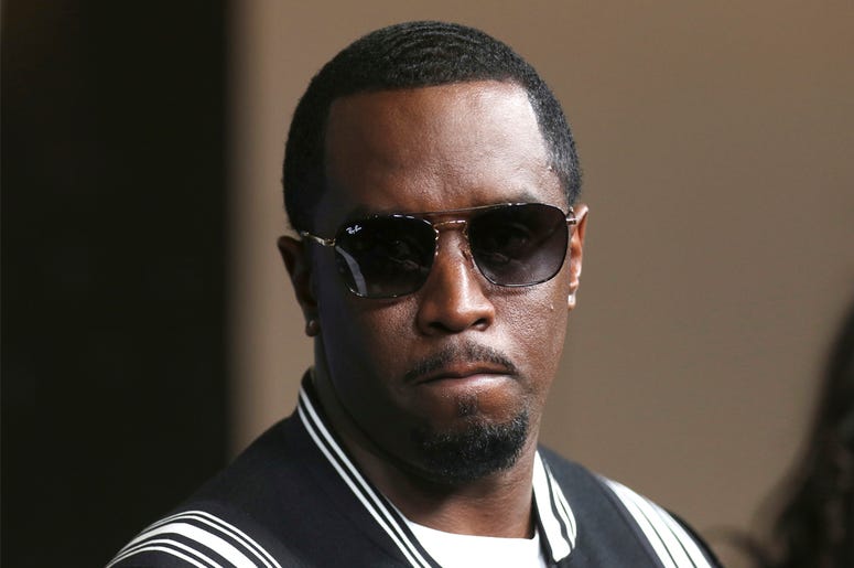 AP18296470780877 In this May 30, 2018, file photo, Sean Combs arrives at the LA Premiere of "The Four: Battle For Stardom" at the CBS Radford Studio Center in Los Angeles. Combs has pledged $1 million to a network of charter schools for a new location in the Bronx. (Photo