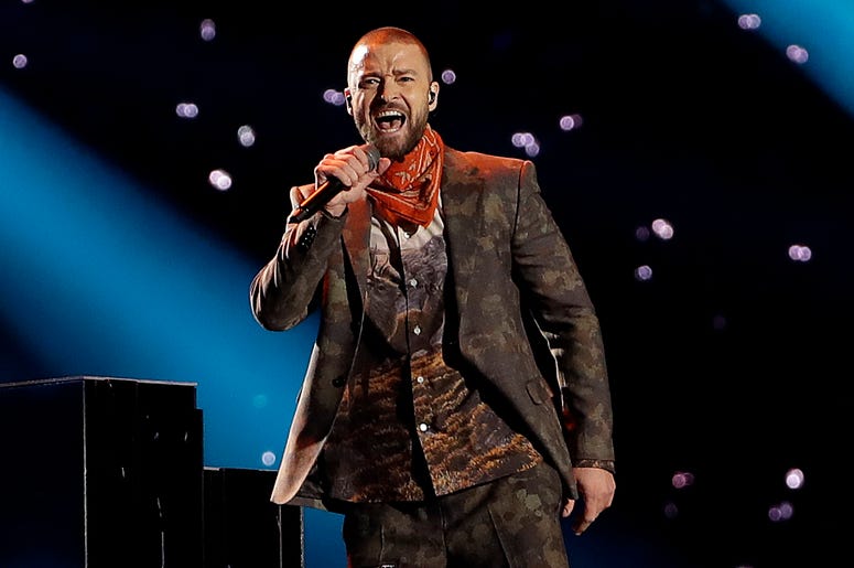 AP18297747569931 In this Feb. 4, 2018 file photo, Justin Timberlake performs during halftime of the NFL Super Bowl 52 football game in Minneapolis. Timberlake says he is postponing his Wednesday night concert in New York City because his vocal chords are “severely bruised