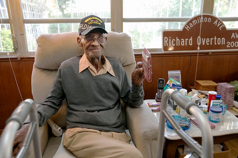 AP18362070581131 In this May 10, 2018 photo Richard Overton, the oldest living U.S. Veteran at the age of 111, is back in the east Austin home he has owned since 1948 after a renovation provided by Meals on Wheels of Central Texas and the Home Depot Foundation. A family m
