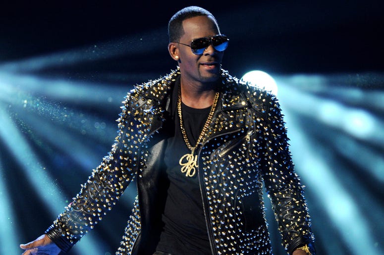 AP19008793893025 In this June 30, 2013 file photo, R. Kelly performs at the BET Awards in Los Angeles. A Georgia man involved with a recent documentary detailing abuse allegations against R. Kelly told police the singer's manager threatened him. A Stockbridge police repor