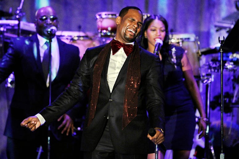 AP19010669812098 This Feb. 12, 2011 file photo shows R. Kelly performing at the pre-Grammy gala & salute to industry icons with Clive Davis honoring David Geffen in Beverly Hills, Calif. Kelly, one of the top-selling recording artists of all time, has been hounded for yea