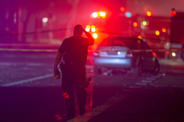 AP19011229043637 Davis Police closed the area near 5th and C streets in Davis, Calif., after a police officer was shot on Thursday, Jan. 10, 2019. A Davis police officer was shot Thursday night while responding to a traffic accident, and authorities cordoned off parts of