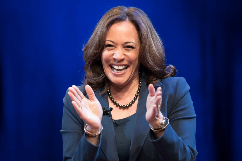 AP19021439945544 In this Jan. 9, 2019 photo, Sen. Kamala Harris, D-Calif., greets the audience at George Washington University in Washington, during an event kicking off her book tour. Harris, a first-term senator and former California attorney general known for her rigor